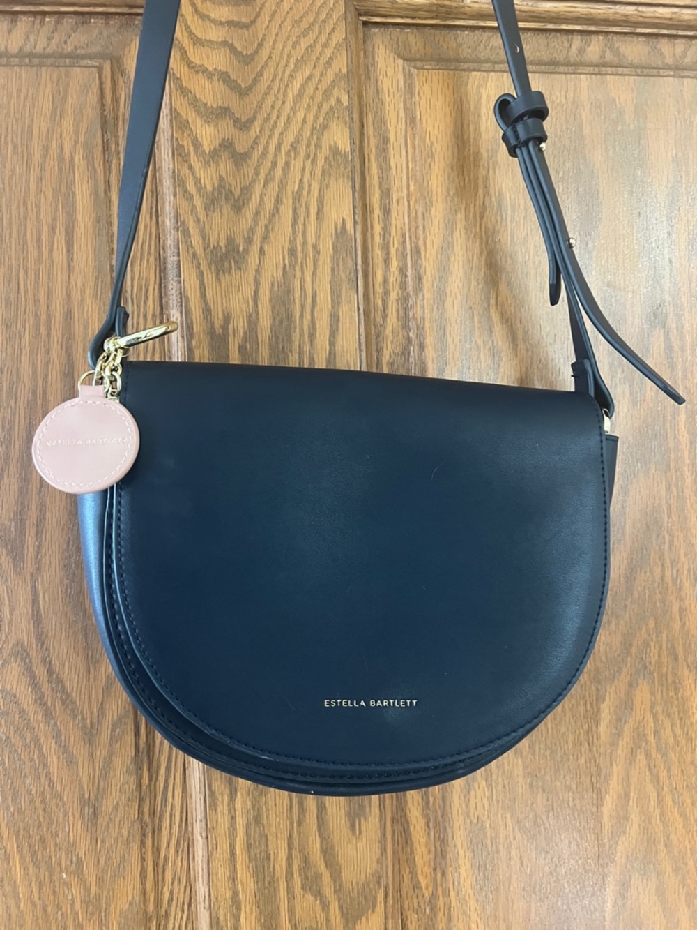 Luiza Estella & Co. Black Saddle Crossbody with Pink Charm